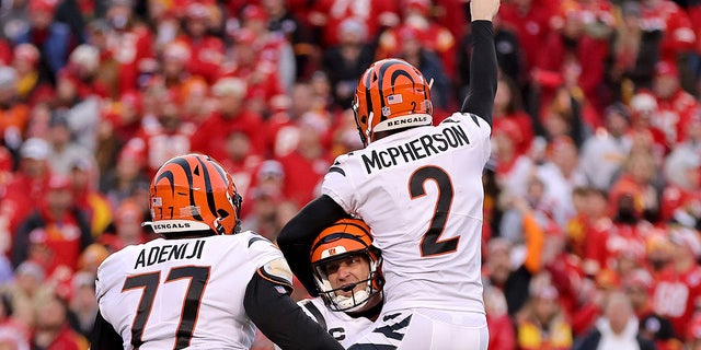 Kicker Evan McPherson #2 of the Cincinnati Bengals celebrates with holder Kevin Huber #10 after hitting the game winning field goal in overtime against the Kansas City Chiefs to win the AFC Championship Game at Arrowhead Stadium on January 30, 2022 in Kansas City, Missouri.