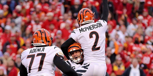 Kicker Evan McPherson #2 of the Cincinnati Bengals celebrates with holder Kevin Huber #10 after hitting the game winning field goal in overtime against the Kansas City Chiefs to win the AFC Championship Game at Arrowhead Stadium on January 30, 2022 in Kansas City, Missouri.