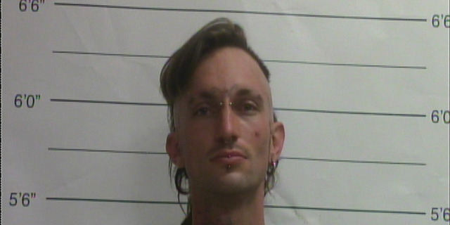Benjamin Beale is accused of running a meth lab at a home where police also found a woman's dismembered body in a freezer.