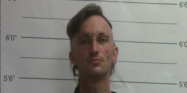 Benjamin Beale is accused of running a meth lab at a home where police also found a woman's dismembered body in a freezer.