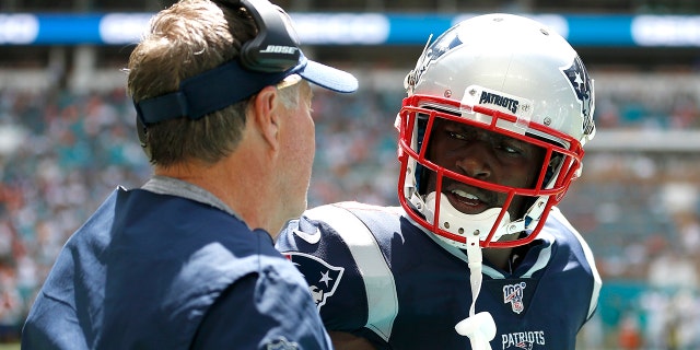 Antonio Brown of the New England Patriots celebrates with head coach Bill Belichick after scoring a 20-yard touchdown thrown by Tom Brady against the Miami Dolphins during the second quarter in the game at Hard Rock Stadium on Sept. 15, 2019, in Miami, Florida.