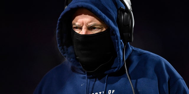 New England Patriots head coach Bill Belichick works the sidelines during the first half of an NFL wild-card playoff football game against the Buffalo Bills, Saturday, Jan. 15, 2022, in Orchard Park, N.Y.