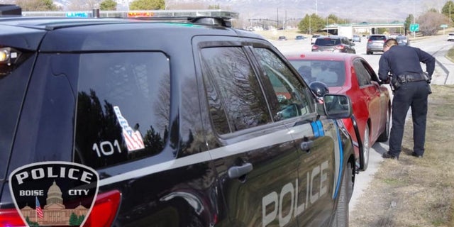 A Boise police officer conducts a traffic stop.