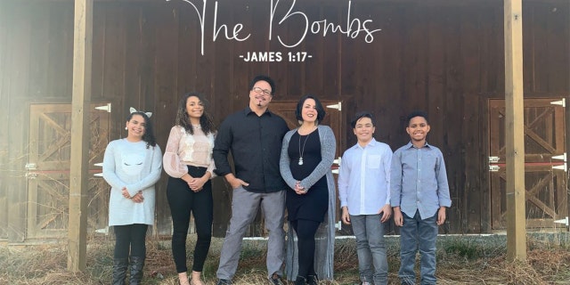 Members of the Bomberger family, with Ryan Bomberger and his wife Bethany in the center, are shown here.