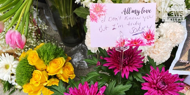 A note left with flowers was among the many bouquets left in front of the Croft House furniture shop in Los Angeles where Brianna Kupfer was killed on Jan. 13.  