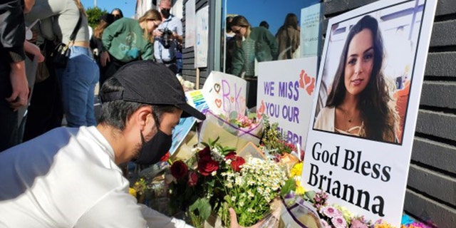 Mourners gathered Thursday in front of the Los Angeles furniture shop to remember Brianna Kupfer, who was stabbed to death inside the store.