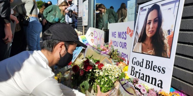 Mourners gathered Thursday in front of the Los Angeles furniture shop to remember Brianna Kupfer, who was stabbed to death inside the store.