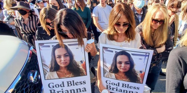 Mourners gathered Thursday in front of the Los Angeles furniture shop to remember Brianna Kupfer, who was stabbed to death inside the store last week. 