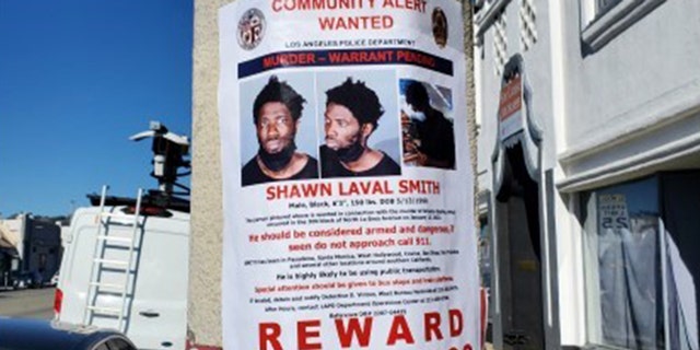 Shawn Laval Smith, 31, pictured on a wanted poster near the Croft House. 