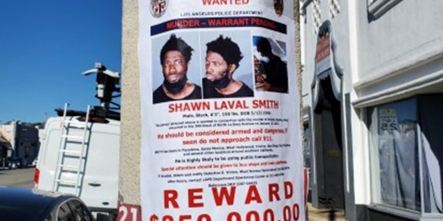 Shawn Laval Smith, 31, pictured on a wanted poster near the Croft House.