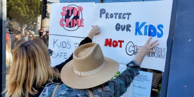 Several people brought homemade signs demanding tougher penalties for criminals.