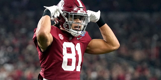 Alabama tight end Cameron Latu (81) celebrates after a touchdown catch against Cincinnati during the second half of the Cotton Bowl NCAA College Football Playoff semifinal game, Friday, Dec. 31, 2021, in Arlington, Texas.