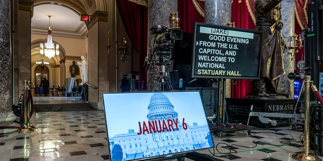 A year after the Jan. 6 attack on the Capitol, television cameras and video monitors fill Statuary Hall in preparation for news coverage, on Capitol Hill in Washington, Wednesday, Jan. 5, 2022. (AP Photo/J. Scott Applewhite)