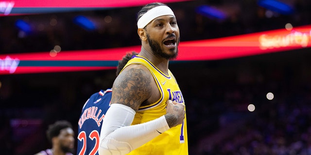 Los Angeles Lakers forward Carmelo Anthony reacts with fans during the third quarter against the Philadelphia 76ers Jan. 27, 2022, at Wells Fargo Center in Philadelphia. 