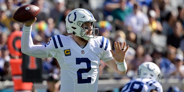 Indianapolis Colts quarterback Carson Wentz (2) throws a pass against the Jacksonville Jaguars during the first half of an NFL football game, Sunday, Jan. 9, 2022, in Jacksonville, Fla.