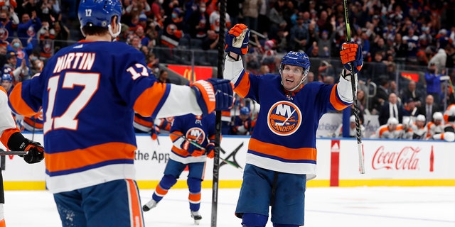 New York Islanders center Casey Cizikas (53) celebrates after his goal in the second period of an NHL hockey game against the Philadelphia Flyers with teammate left wing Matt Martin (17) on Monday, Jan. 17, 2022, in Elmont, N.Y.