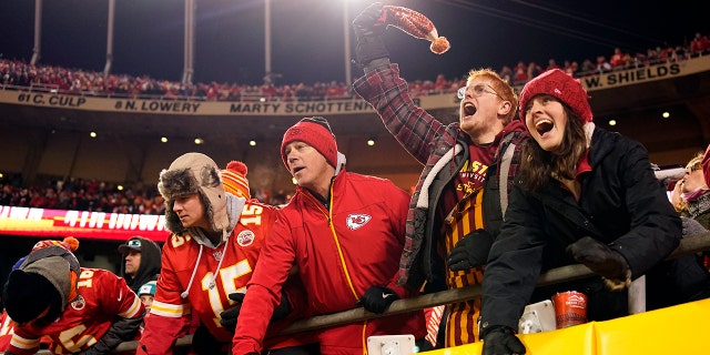 Jan 23, 2022; Kansas City, Missouri, USA; Kansas City Chiefs fans cheer on their team against the Buffalo Bills during the second half of the AFC Divisional playoff football game at GEHA Field at Arrowhead Stadium.