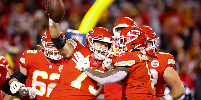 Nick Allegretti #73 of the Kansas City Chiefs celebrates after scoring a touchdown with teammates in the third quarter of the game against the Pittsburgh Steelers in the NFC Wild Card Playoff game at Arrowhead Stadium on January 16, 2022 a Kansas City, Missouri.