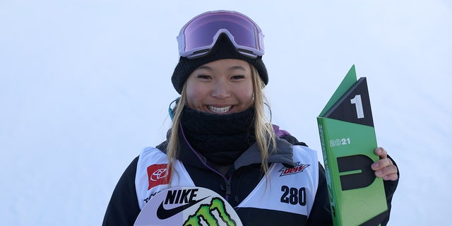 Chloe Kim of Team United States poses for a picture after winning the women's snowboard superpipe final during Day 5 of the Dew Tour at Copper Mountain on Dec. 19, 2021, in Copper Mountain, Colorado. 