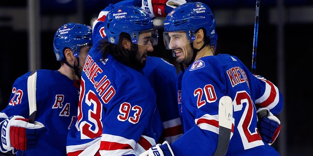 New York Rangers' Chris Kreider (20) celebrates his power-play goal with teammate Mika Zibanejad (93) against the Edmonton Oilers during the third period of an NHL hockey game, Monday, Jan. 3, 2022, in New York. The Rangers won 4-1.