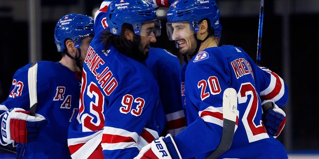 New York Rangers' Chris Kreider (20) celebrates his power-play goal with teammate Mika Zibanejad (93) against the Edmonton Oilers during the third period of an NHL hockey game, Monday, Jan. 3, 2022, in New York. The Rangers won 4-1.