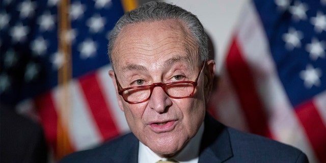 Senate Majority Leader Chuck Schumer, D-N.Y., responds to questions from reporters during a press conference regarding the Democratic party's shift to focus on voting rights at the Capitol in Washington, Tuesday, Jan. 18, 2022. (AP Photo/Amanda Andrade-Rhoades)