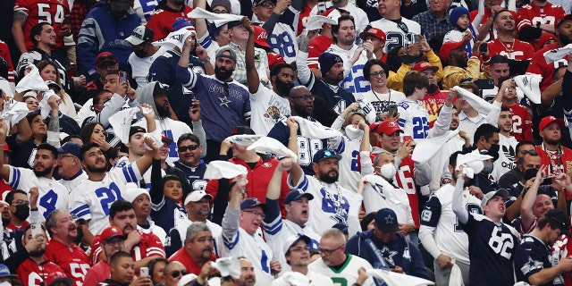 Dallas Cowboys fans cheer during the first quarter of a game against the San Francisco 49ers in the NFC Wild Card Playoff game at AT&T Stadium on January 16, 2022 in Arlington, Texas.