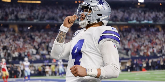 Dallas Cowboys quarterback Dak Prescott (4) celebrates running the ball for a touchdown in the second half of an NFL wild-card playoff football game against the San Franciso 49ers in Arlington, Texas, Sunday, Jan. 16, 2022. (WHD Photo/Ron Jenkins)