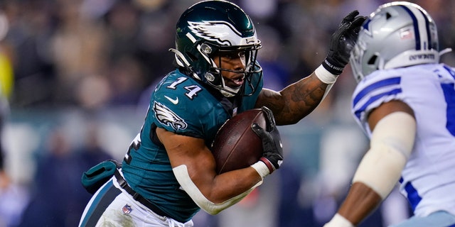 Philadelphia Eagles running back Kenneth Gainwell runs with the ball during the first half of an NFL football game against the Dallas Cowboys, Saturday, Jan. 8, 2022, in Philadelphia. (AP Photo/Julio Cortez)