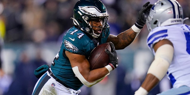 Philadelphia Eagles running back Kenneth Gainwell runs with the ball during the first half of an NFL football game against the Dallas Cowboys, Saturday, Jan. 8, 2022, in Philadelphia. (AP Photo/Julio Cortez)