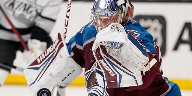 Colorado Avalanche goaltender Darcy Kuemper deflects a shot during the second period of an NHL hockey game against the Los Angeles Kings Thursday, Jan. 20, 2022, in Los Angeles.