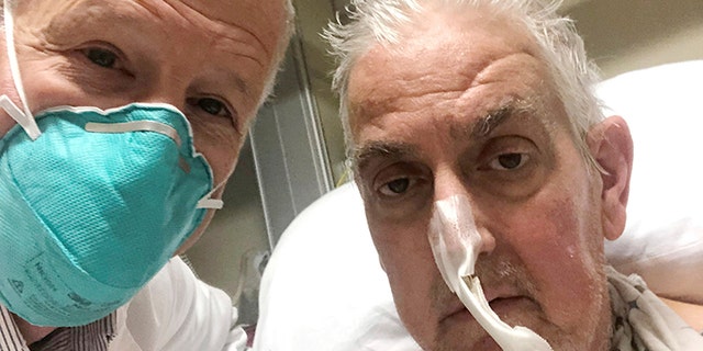 Dr. Bartley Griffith in a selfie with patient David Bennett in Baltimore in January 2022. In a medical first, doctors transplanted a pig heart into Bennett in a last-ditch effort to save his life.