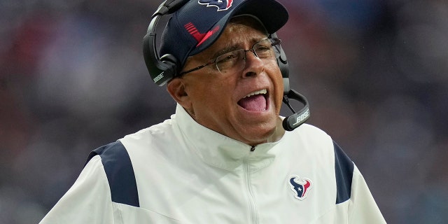 Houston Texans head coach David Culley questions a call during the first half of an NFL football game against the Tennessee Titans, Sunday, Jan. 9, 2022, in Houston.