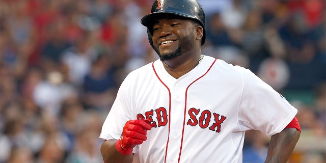 BOSTON, MA - JUNIE 25: David Ortiz #34 of the Boston Red Sox smiles after scoring a run against the Colorado Rockies in the 2nd inning at Fenway Park on June 25, 2013 in Boston, Massachusetts. (Photo by Jim Rogash/Getty Images)