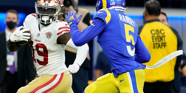 San Francisco 49ers' Deebo Samuel (19) gets past Los Angeles Rams' Jalen Ramsey for a touchdown during the first half of the NFC Championship NFL football game Sunday, Jan. 30, 2022, in Inglewood, Calif.