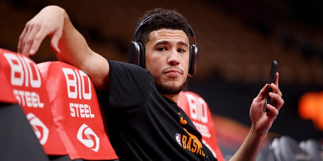 Devin Booker of the Phoenix Suns warms up ahead of their game against the Toronto Raptors at Scotiabank Arena Jan. 11, 2022 in Toronto.