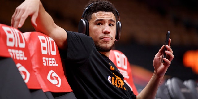 Devin Booker of the Phoenix Suns warms up ahead of their game against the Toronto Raptors at Scotiabank Arena Jan. 11, 2022 in Toronto.