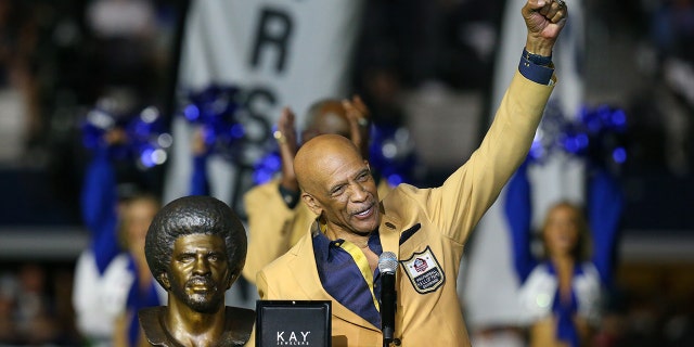 Former Dallas Cowboy Drew Pearson celebrates receiving his Hall of Fame ring at halftime during a game between the Philadelphia Eagles and Dallas Cowboys Sept. 27, 2021, in Arlington, Texas.