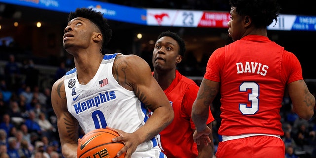 Memphis Tigers guard Earl Timberlake (0) drives to the basket during the first half against the Southern Methodist Mustangs at FedExForum on Jan 20, 2022, in Memphis, Tennessee. 