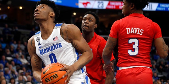 Memphis Tigers guard Earl Timberlake (0) drives to the basket during the first half against the Southern Methodist Mustangs at FedExForum on Jan 20, 2022, in Memphis, Tennessee. 