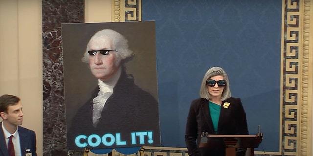 Sen. Joni Ernst, R-Iowa, wears sunglasses and tells Democrats to 'cool it' on changing the Senate filibuster in a floor speech on Jan. 12, 2022.