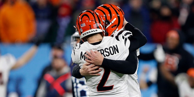 Kicker Evan McPherson celebrates his game-winning kick with holder Kevin Huber during the Cincinnati Bengals' 19-16 win over the Tennessee Titans in the AFC Divisional Playoff game at Nissan Stadium on Jan. 22, 2022, in Nashville.