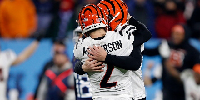 Kicker Evan McPherson celebrates his game-winning kick with holder Kevin Huber during the Cincinnati Bengals' 19-16 win over the Tennessee Titans in the AFC Divisional Playoff game at Nissan Stadium on Jan. 22, 2022, in Nashville.