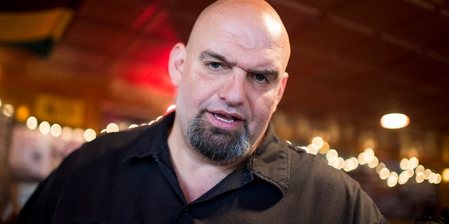 U.S. Senate candidate and Braddock, Pa. Mayor John Fetterman speaks with supporters during his meet and greet campaign stop at the Interstate Drafthouse in Philadelphia on Sunday, April 3, 2016.
