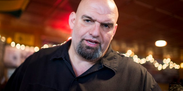 U.S. Senate candidate John Fetterman speaks with supporters during a campaign stop at the Interstate Drafthouse in Philadelphia.