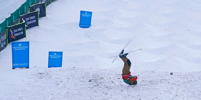 United States' George McQuinn crashes at the end of a run in the finals of a World Cup freestyle moguls competition at Deer Valley Resort in Park City, Utah, Thursday, Jan. 13, 2022.