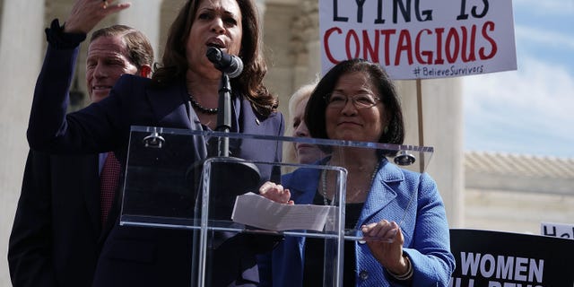 U.S. Sen. Kamala Harris (D-CA) (2nd L) speaks as Sen. Mazie Hirono (D-HI) (R) and Sen. Richard Blumenthal (D-CT) (L) listen during a rally in front of the U.S. Supreme Court September 28, 2018 in Washington, DC.