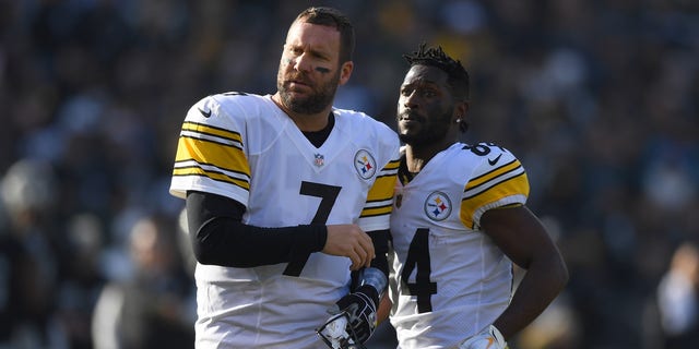 Antonio Brown #84 and Ben Roethlisberger #7 of the Pittsburgh Steelers looks on against the Oakland Raiders during the first half of their NFL football game at Oakland-Alameda County Coliseum on December 9, 2018, in Oakland, California.  