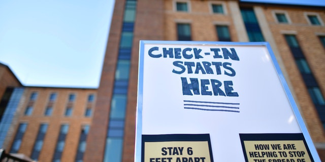 Placards advise physical distancing guidelines due to the coronavirus pandemic while directing incoming freshmen moving into a campus dormitory at University of Colorado Boulder on Aug. 18, 2020, in Boulder, Colorado. (Mark Makela/Getty Images)