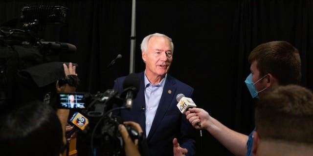 Asa Hutchinson, governor of Arkansas, speaks with members of the media on Monday, July 16, 2021.  Photographer: Liz Sanders/Bloomberg via Getty Images